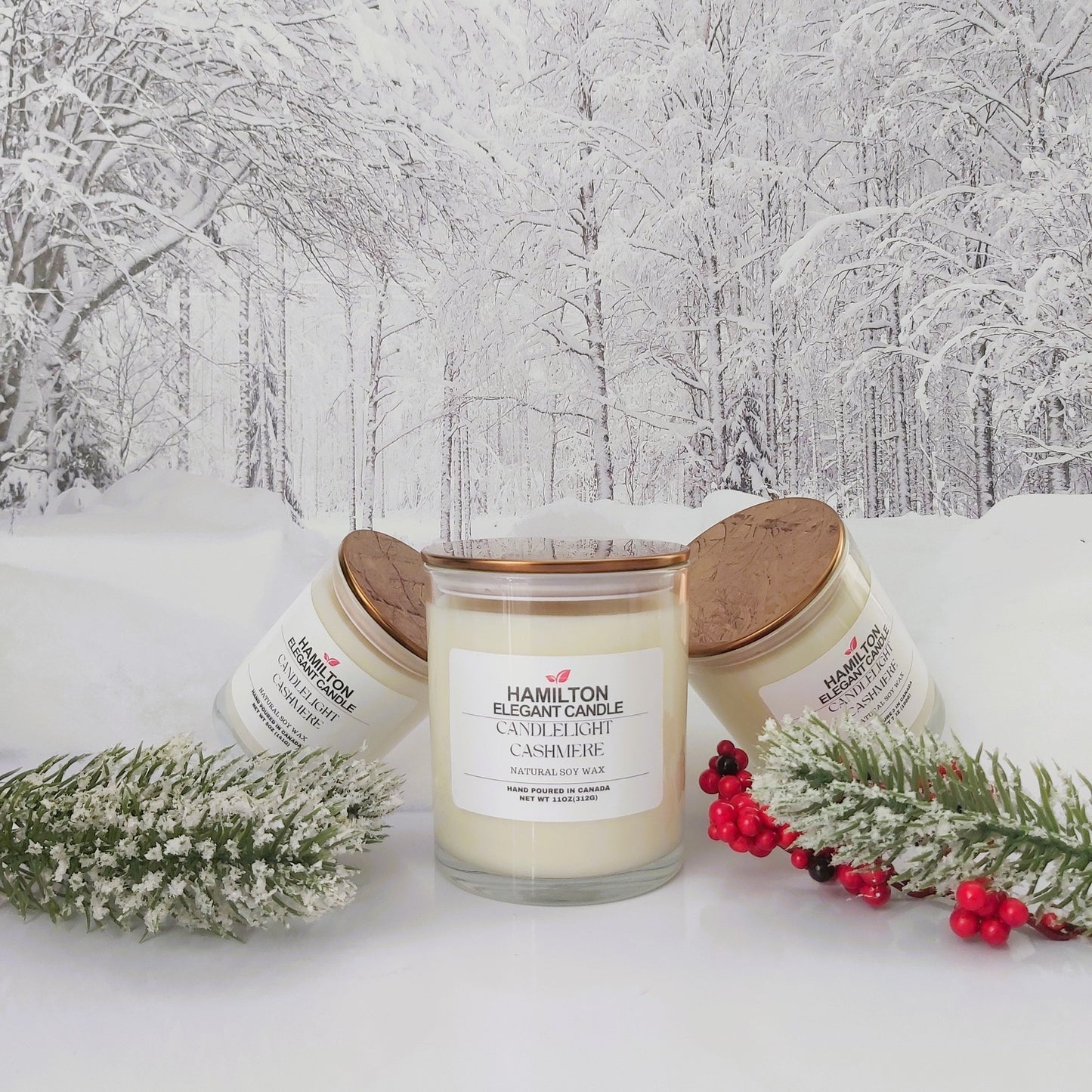 Candle on a snowy background with Christmas decorations