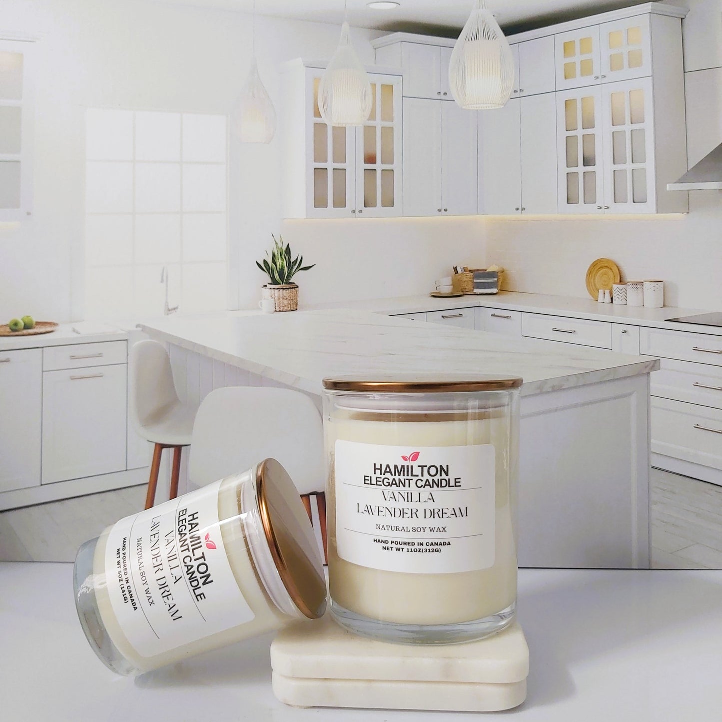 Two candles on a kitchen counter with a white kitchen background