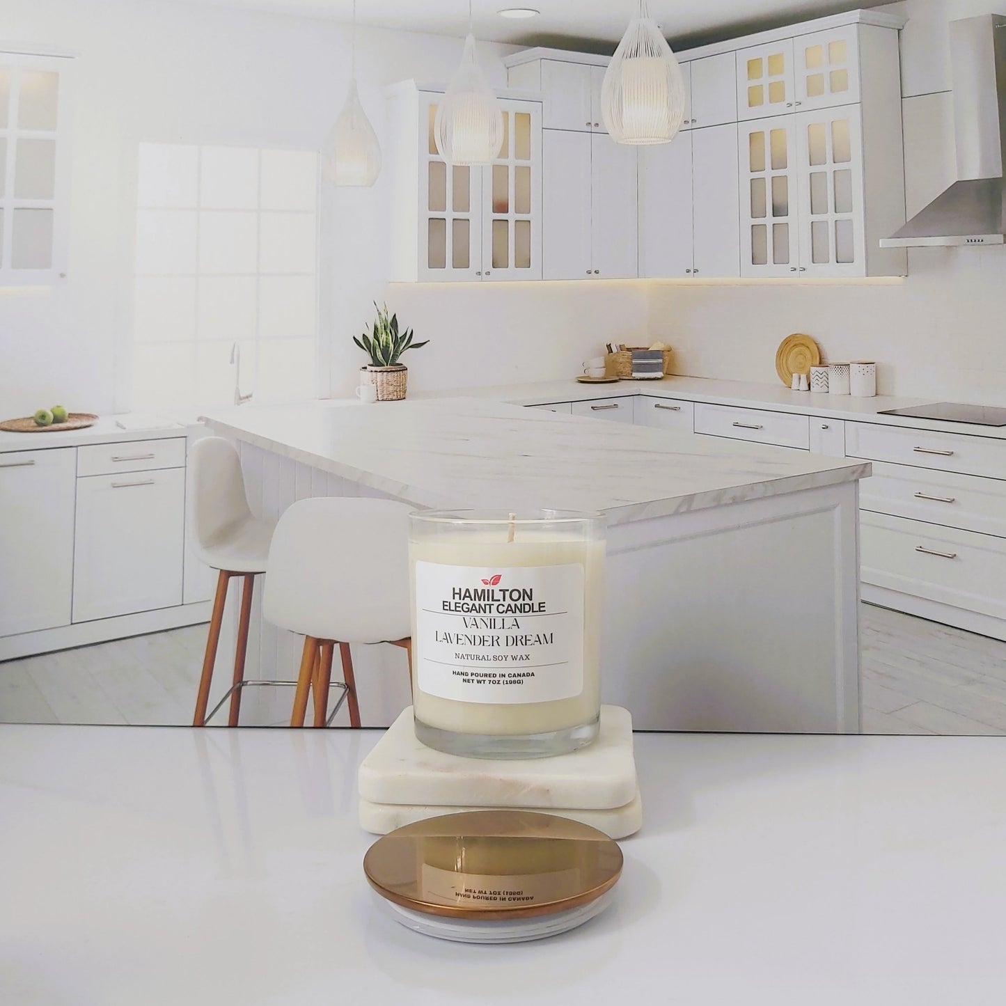 Candle on a kitchen counter with a white kitchen in the background