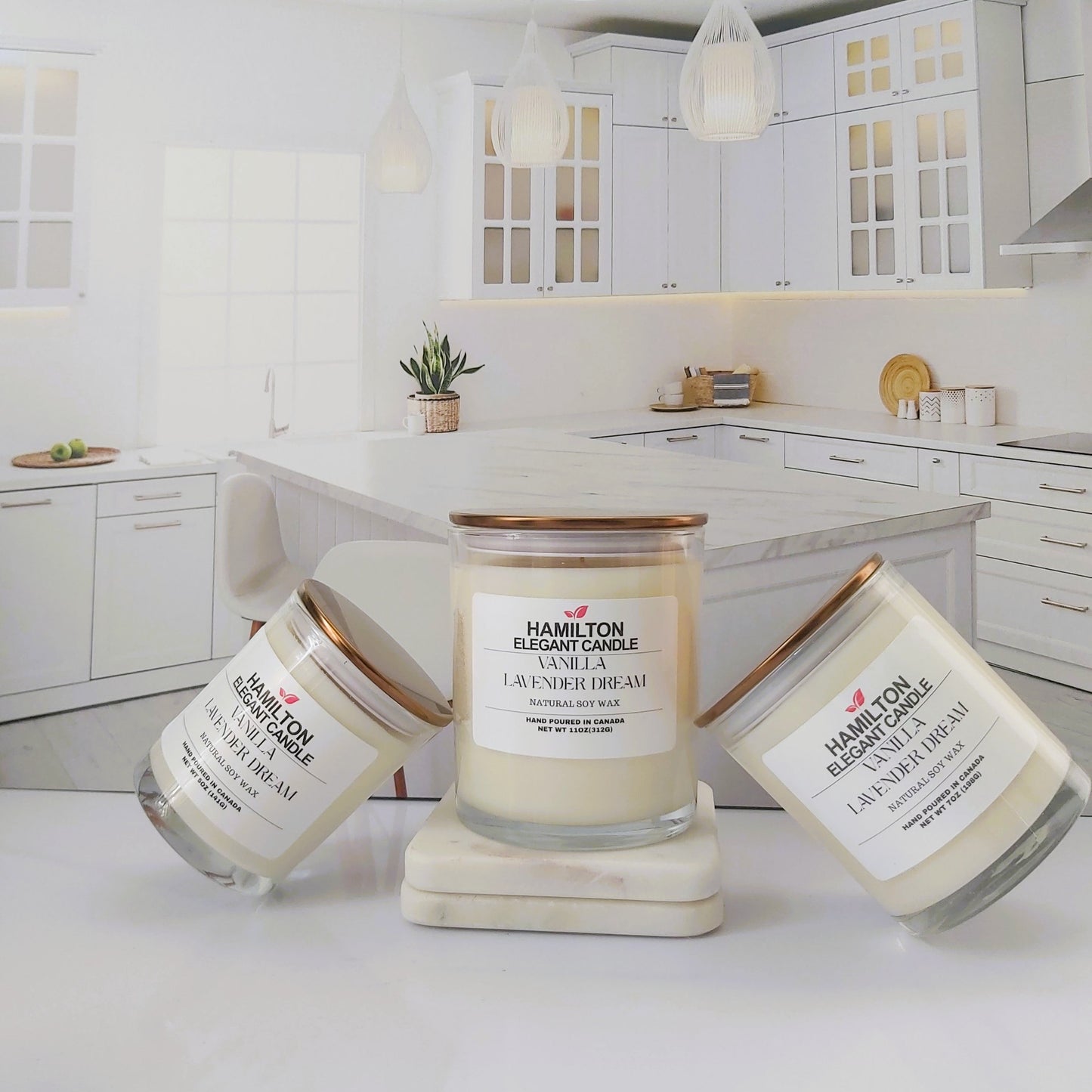 Three candles with labels on a kitchen counter