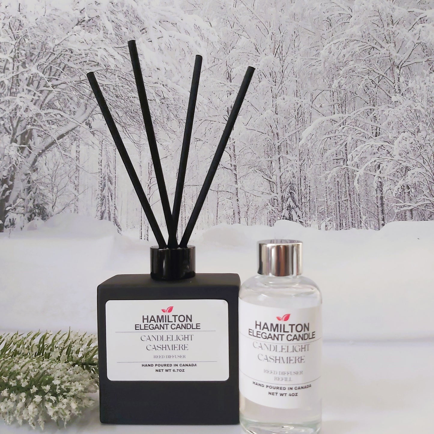 Hamilton Elegant Candle diffuser and bottle against a snowy forest background