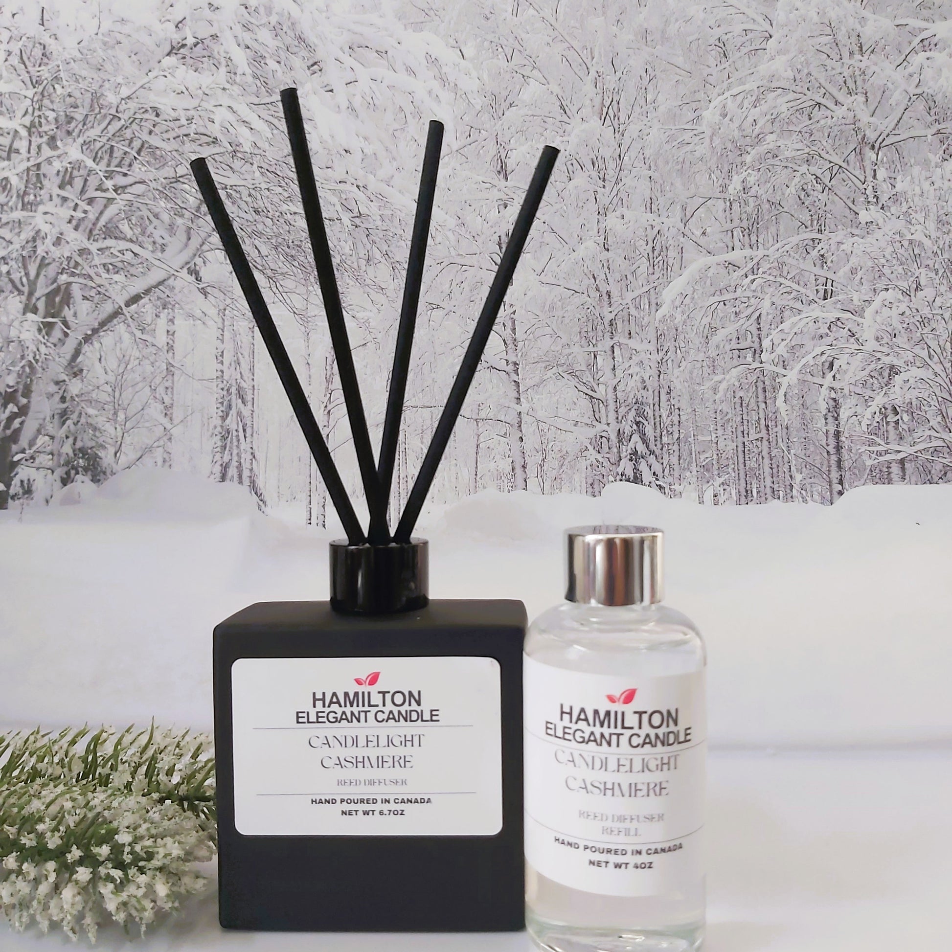 Hamilton Elegant Candle diffuser and bottle against a snowy forest background