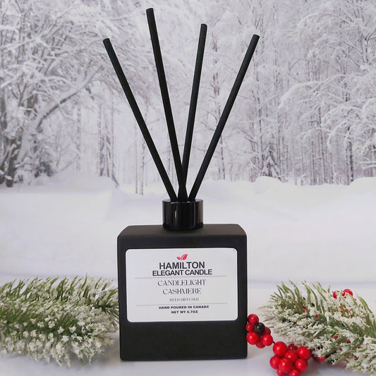Black diffuser with sticks on a snowy background
