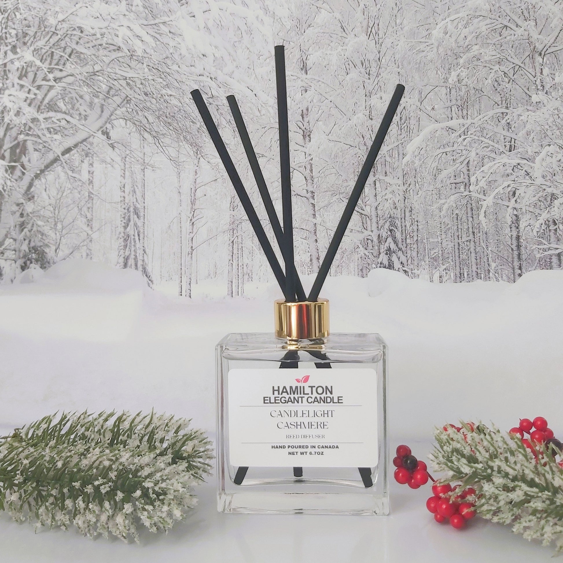 Diffuser with black sticks on a snowy landscape background