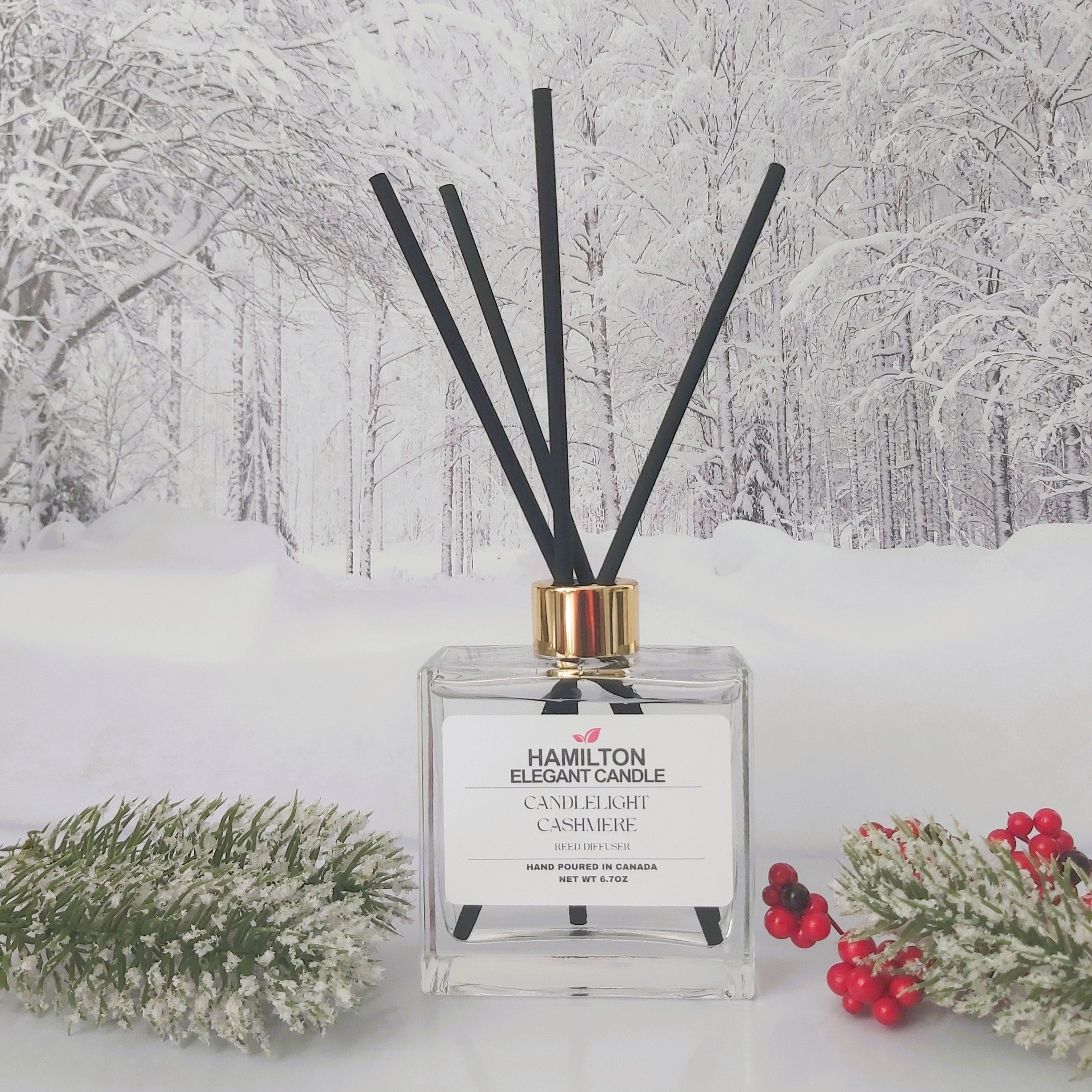 Diffuser with black sticks on a snowy landscape background