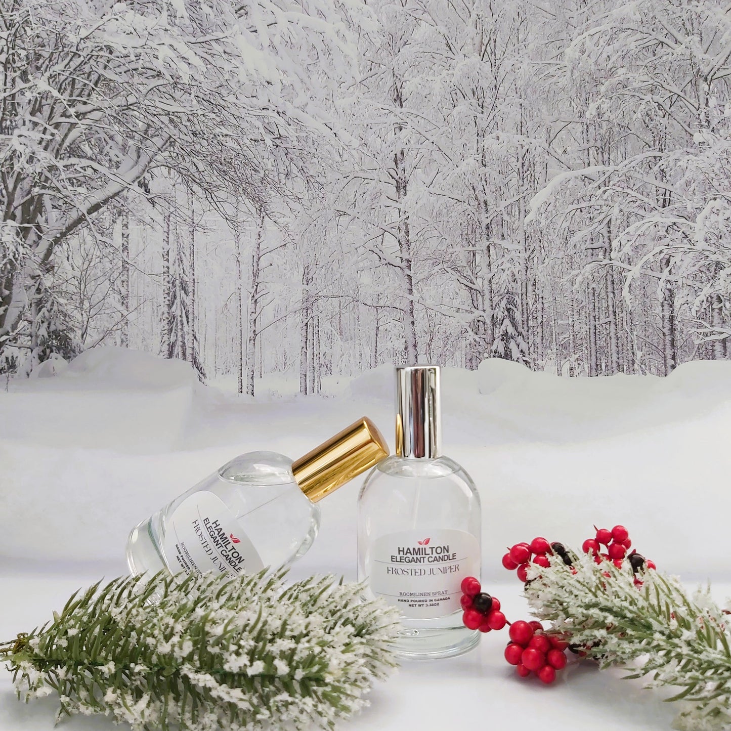 Two perfume bottles on a snowy surface with a winter forest background