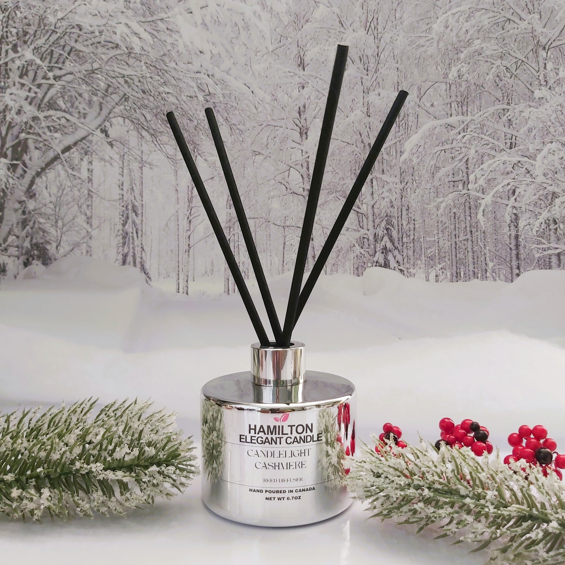 Diffuser with black sticks on a snowy forest background