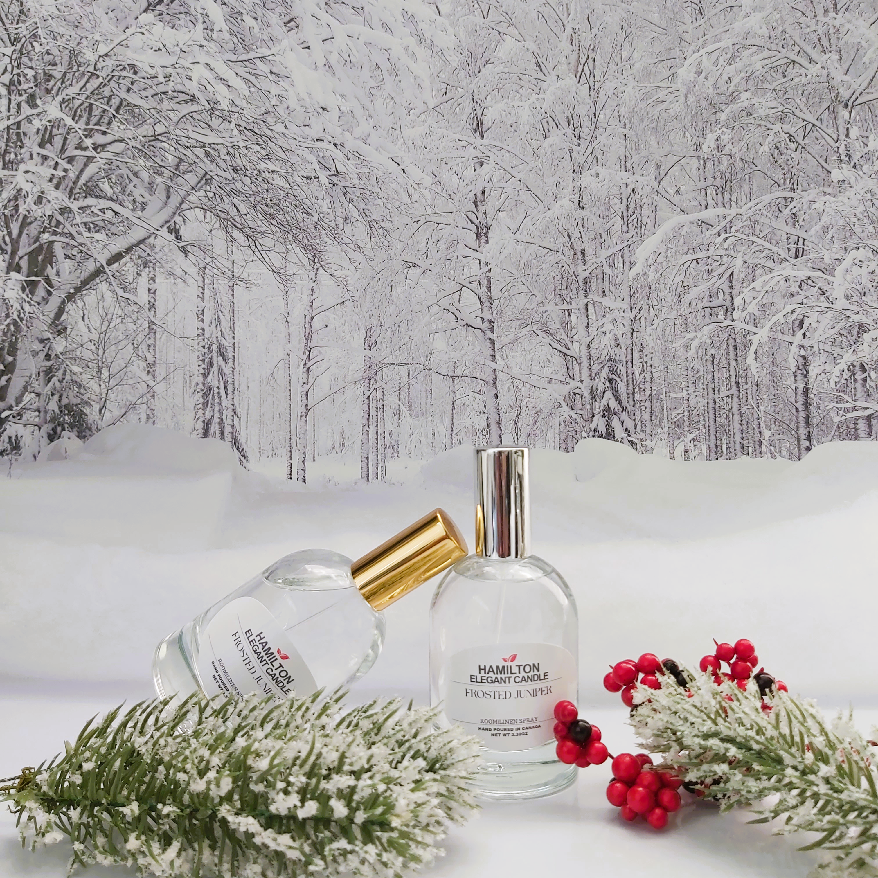 Two perfume bottles with floral decorations on a snowy landscape