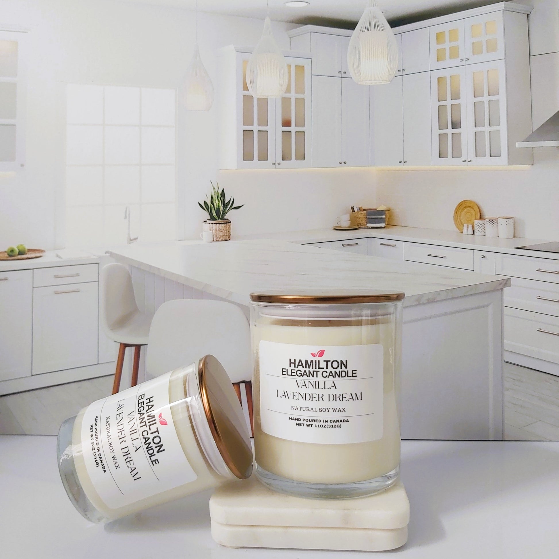 Two candles on a kitchen counter with a white kitchen background