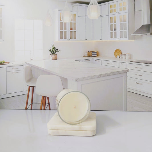 Modern kitchen with white cabinets and marble island
